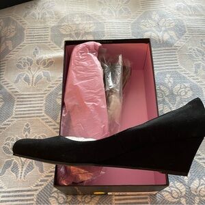 Beautiful, comfortable, stylish black suede wedges. Never worn in original box